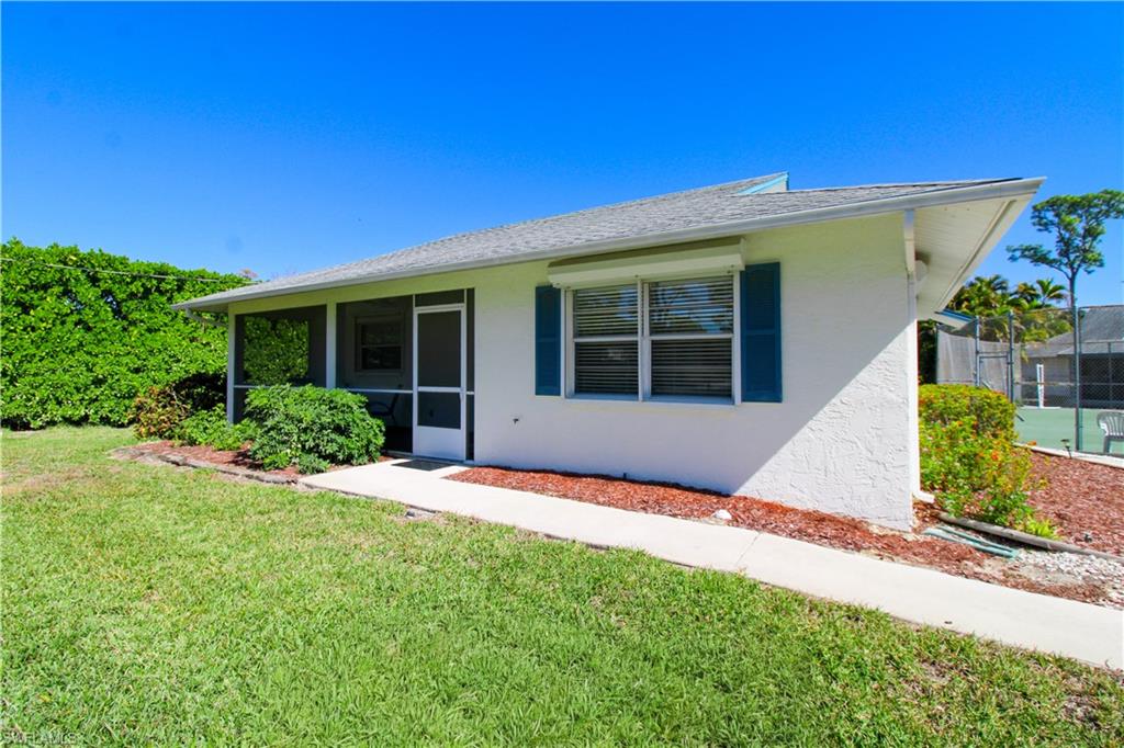 516 Gordonia Road Naples, FL 34108 - Photo 7 of 50 a house view with a garden space