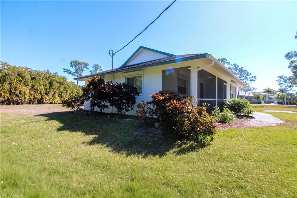 516 Gordonia Road Naples, FL 34108 - Photo 9 of 50 a front view of a house with garden