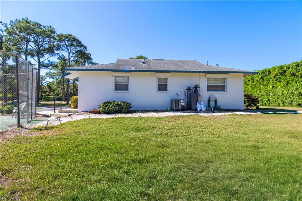 516 Gordonia Road Naples, FL 34108 - Photo 10 of 50 a house view with a garden space