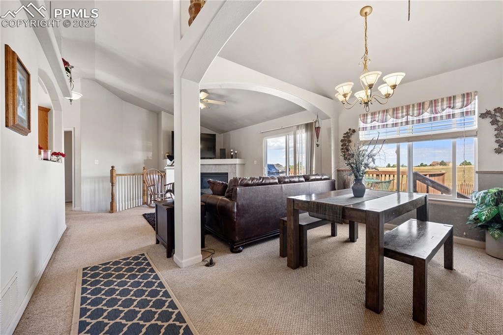 17950 Cumbres Road Peyton, CO 80831 - Photo 16 of 21 a view of a livingroom with furniture and a chandelier