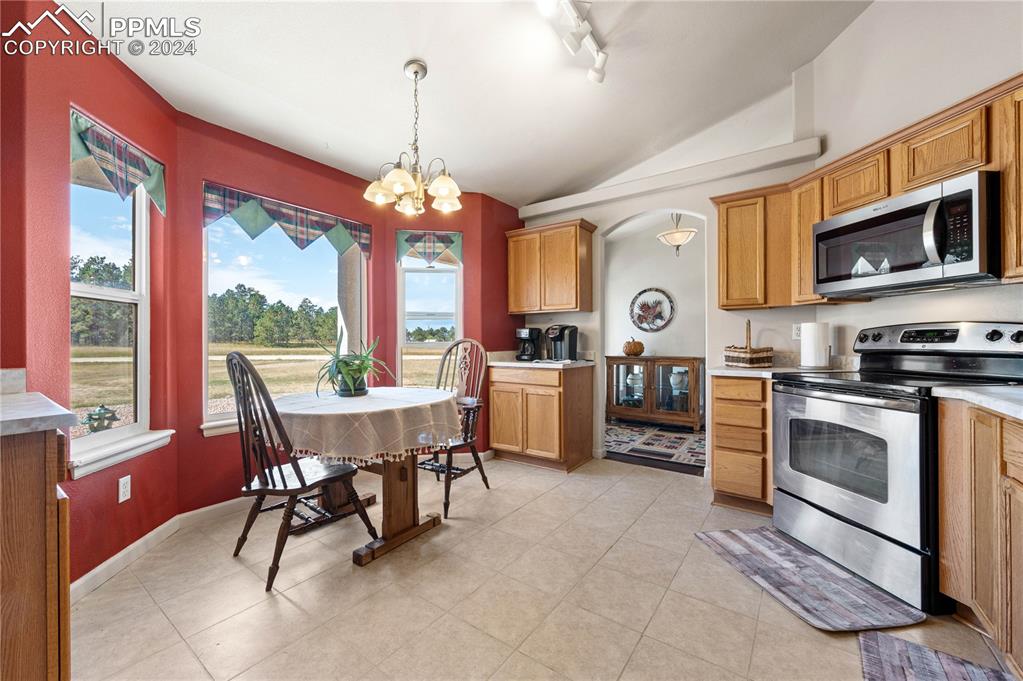 17950 Cumbres Road Peyton, CO 80831 - Photo 2 of 21 a view of a dining room with furniture window and outside view