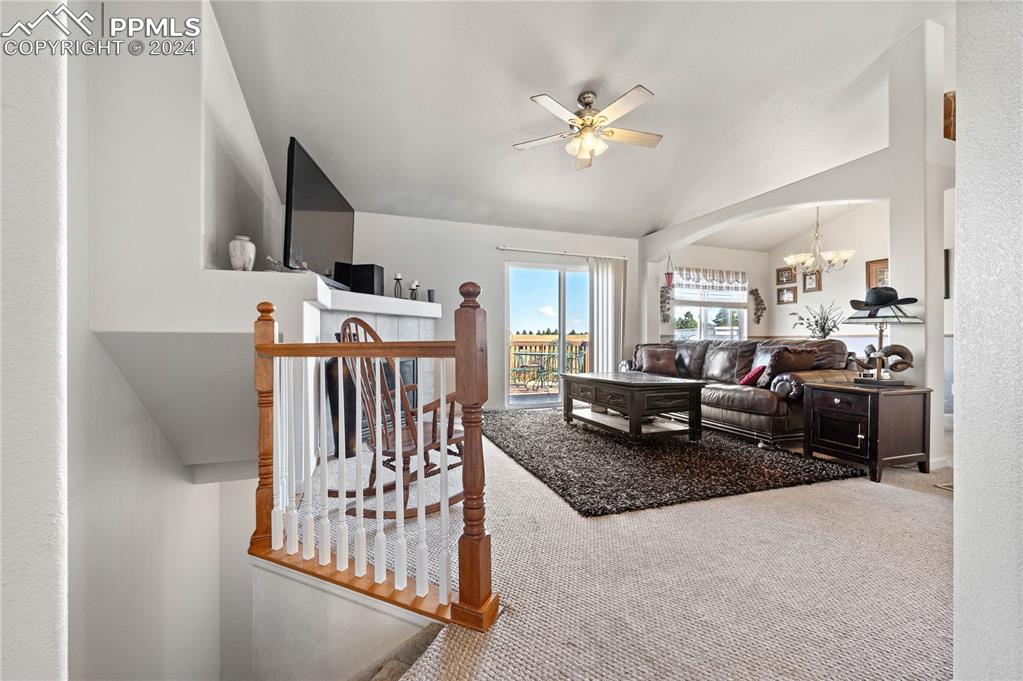17950 Cumbres Road Peyton, CO 80831 - Photo 4 of 21 a living room with furniture and kitchen view