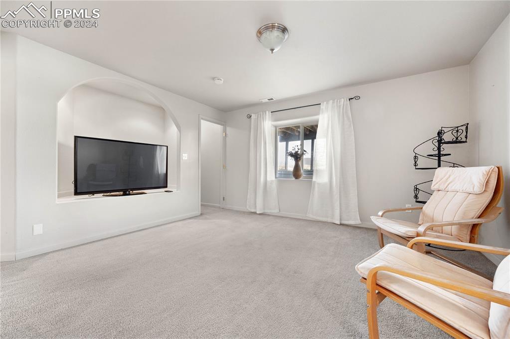 17950 Cumbres Road Peyton, CO 80831 - Photo 7 of 21 a view of workspace with a flat screen tv