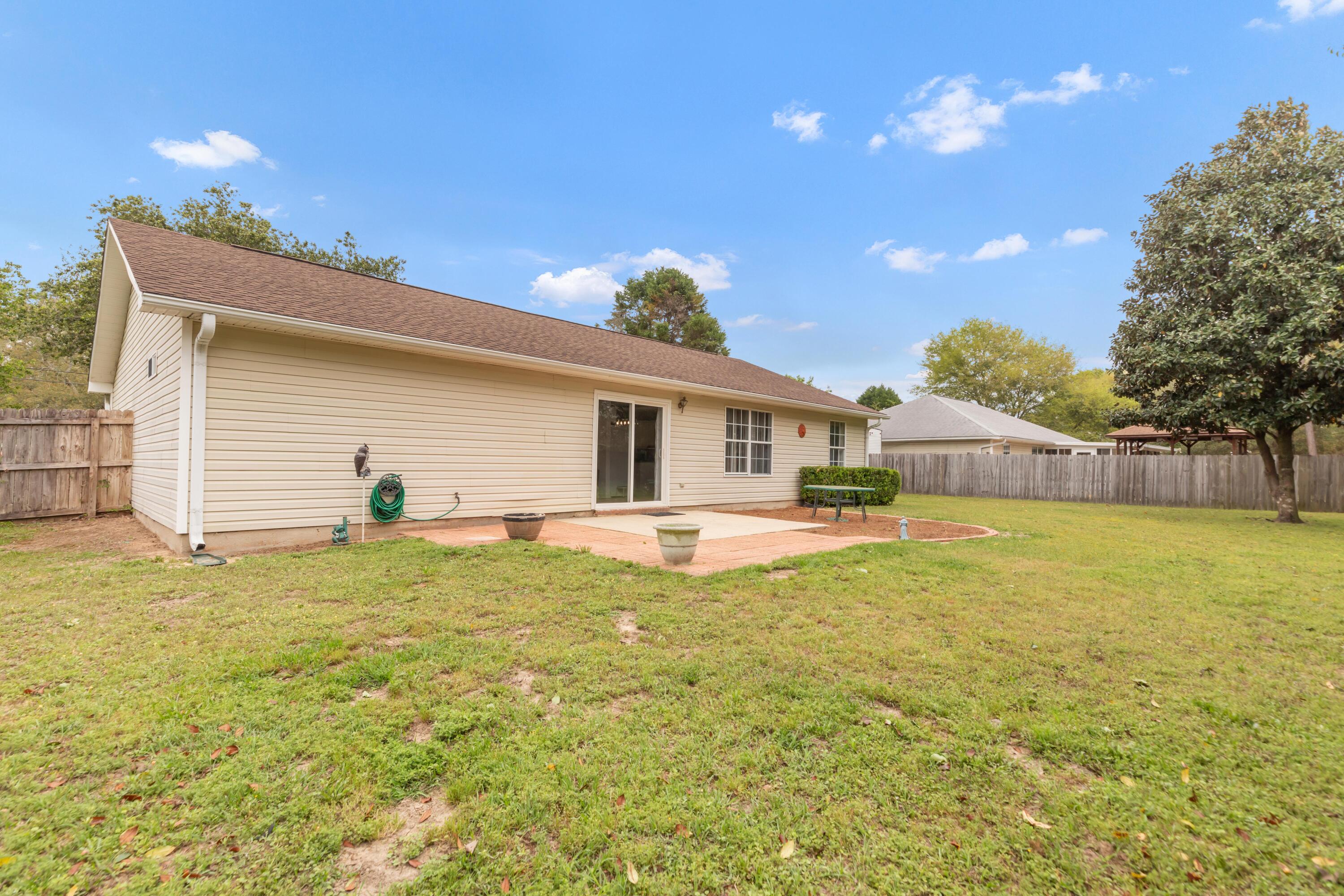 1244 Jefferyscot Drive Crestview, FL 32536 - Photo 38 of 40 a front view of house with yard and seating area