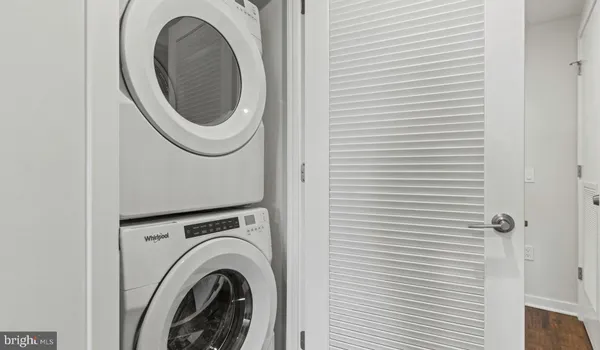 a view of kitchen with cabinets and wooden floor
