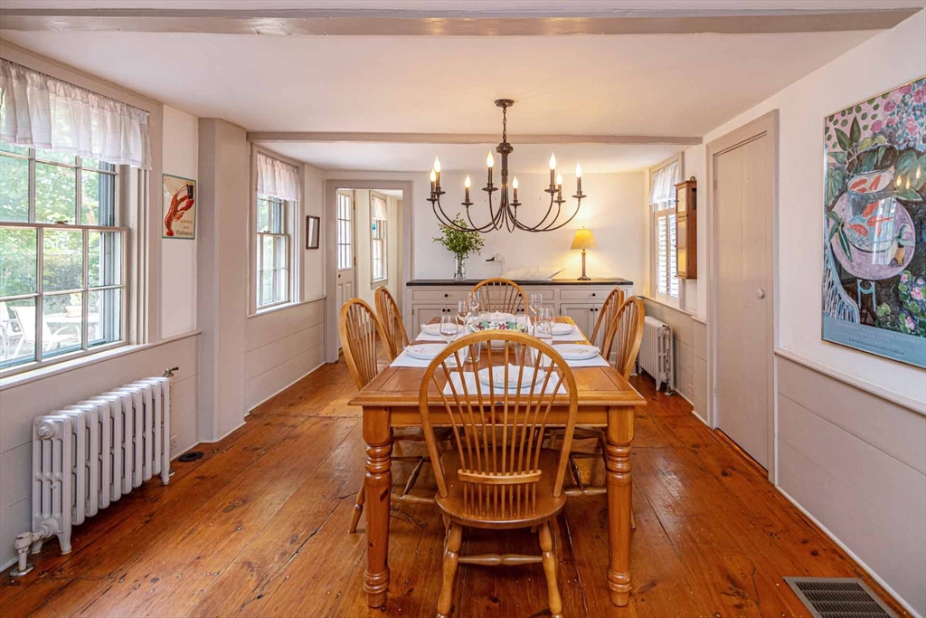 2 Green Avenue Edgartown, MA 02539 - Photo 11 of 42 a view of a dining room with furniture wooden floor and chandelier