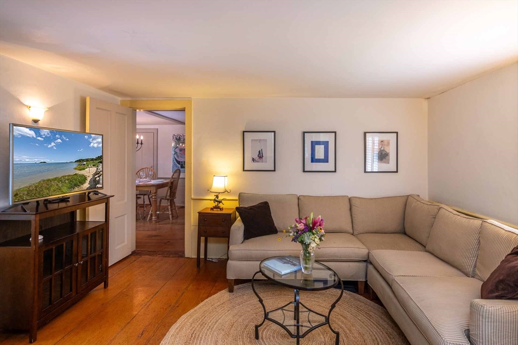 2 Green Avenue Edgartown, MA 02539 - Photo 19 of 42 a living room with furniture and a flat screen tv