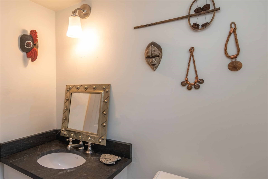2 Green Avenue Edgartown, MA 02539 - Photo 22 of 42 a bathroom with a sink vanity and mirror