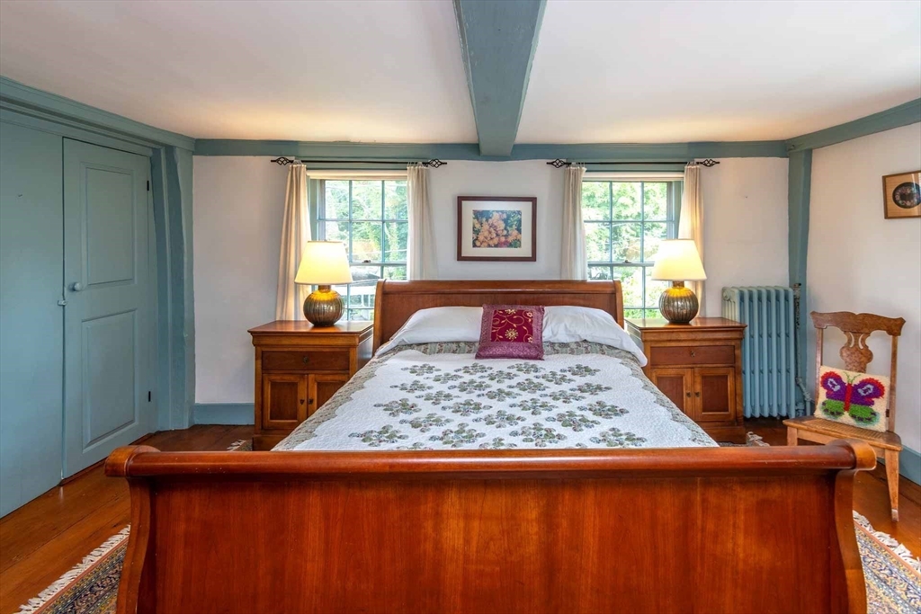 2 Green Avenue Edgartown, MA 02539 - Photo 27 of 42 a bed sitting in a bedroom next to a window