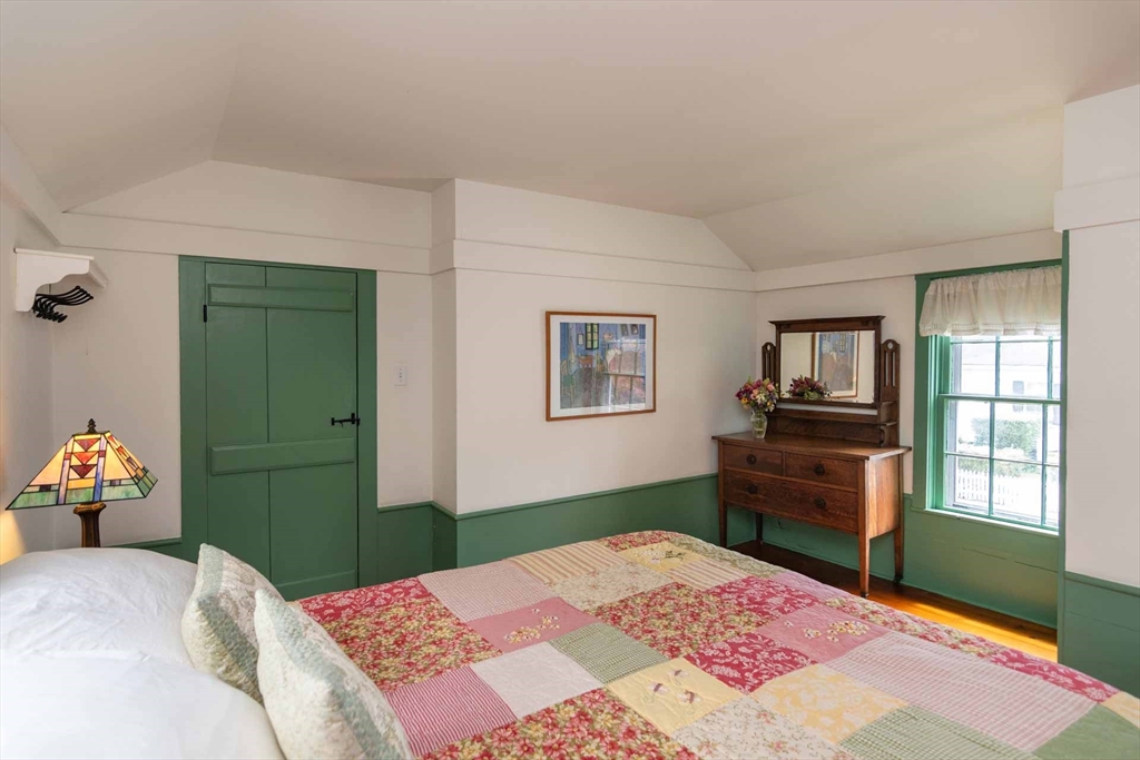 2 Green Avenue Edgartown, MA 02539 - Photo 31 of 42 a bedroom with a bed and a dresser in it
