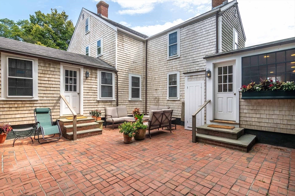 2 Green Avenue Edgartown, MA 02539 - Photo 37 of 42 a backyard of a house with seating space
