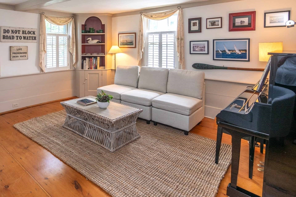 2 Green Avenue Edgartown, MA 02539 - Photo 7 of 42 a living room with furniture fireplace and a window