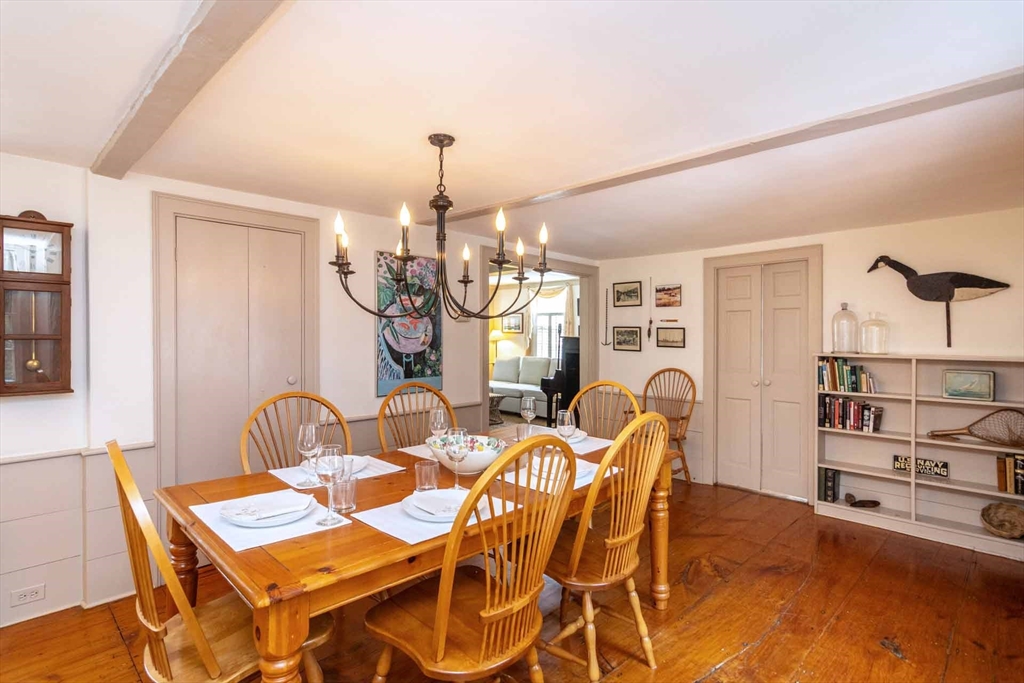 2 Green Avenue Edgartown, MA 02539 - Photo 9 of 42 a view of a dining room with furniture and a chandelier