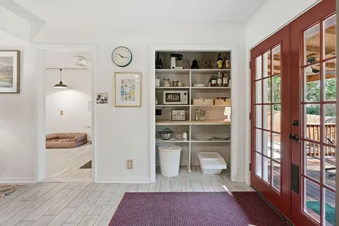 a view of a livingroom with shelves