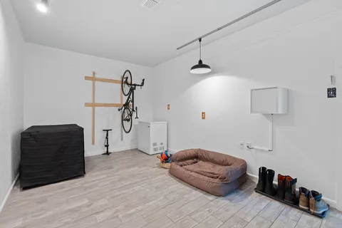 a living room with furniture and a ceiling fan