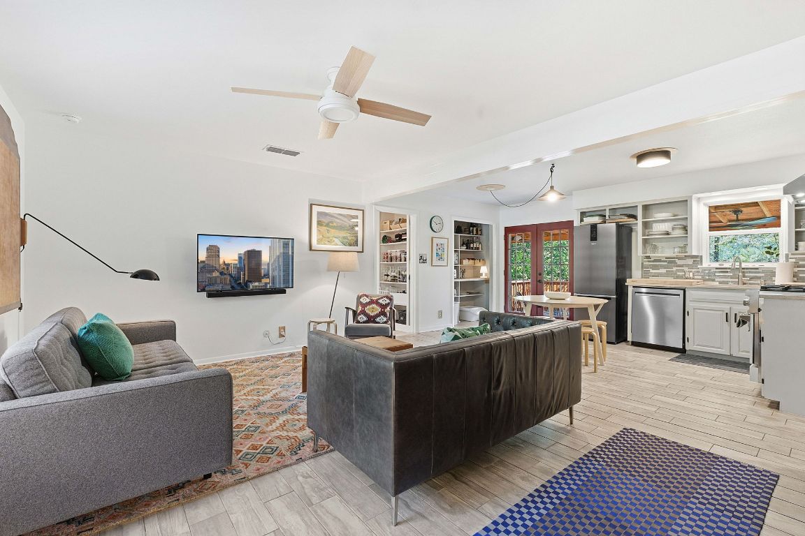 8801 Redfield Lane Austin, TX 78758 - Photo 9 of 31 a living room with furniture kitchen view and a large window