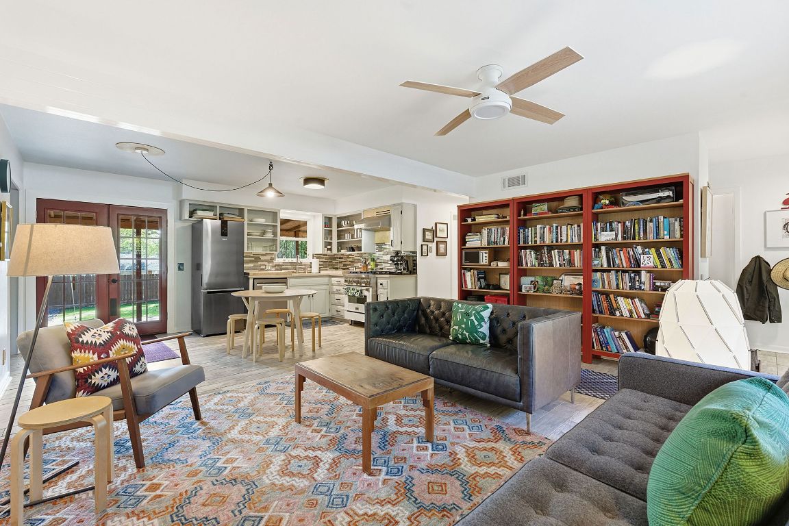 8801 Redfield Lane Austin, TX 78758 - Photo 10 of 31 a living room with furniture kitchen view and a large window