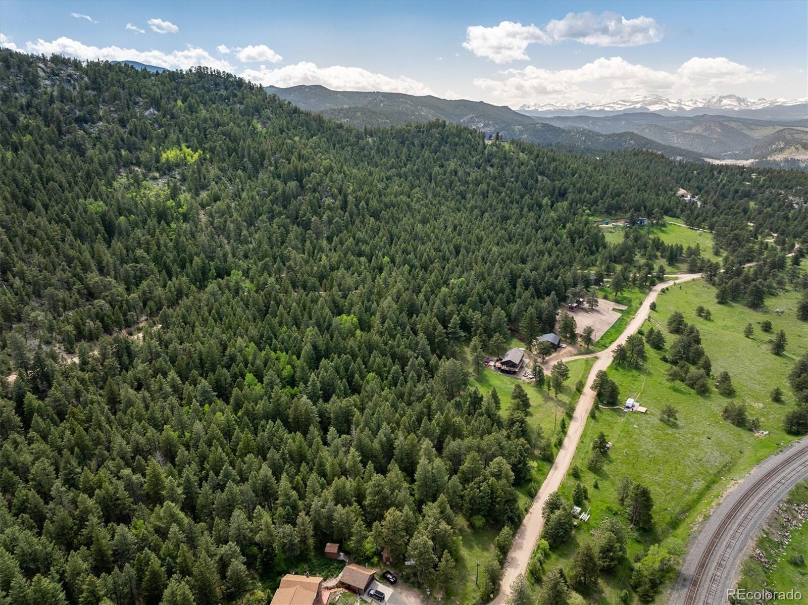 1546 Chute Road Golden, CO 80403 - Photo 13 of 36 a view of a city with lush green forest