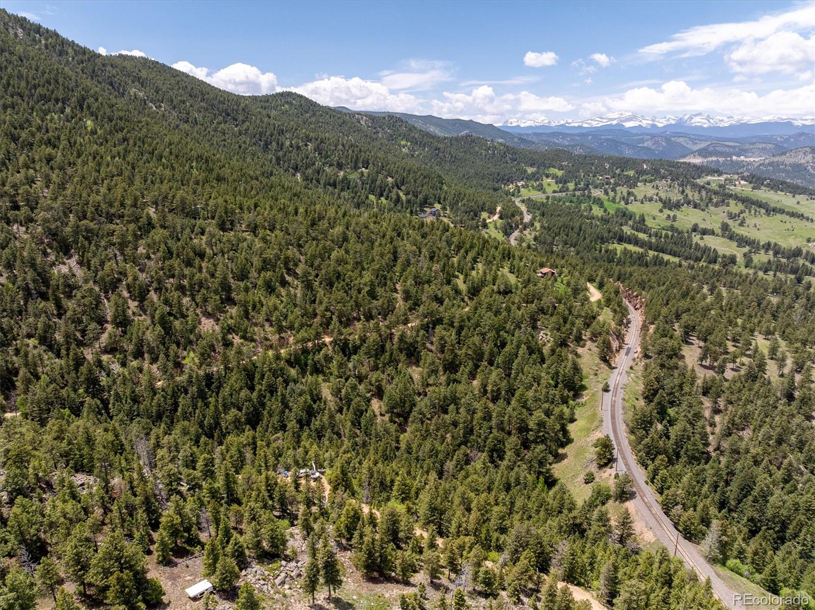 1546 Chute Road Golden, CO 80403 - Photo 21 of 36 a view of a city with lush green forest