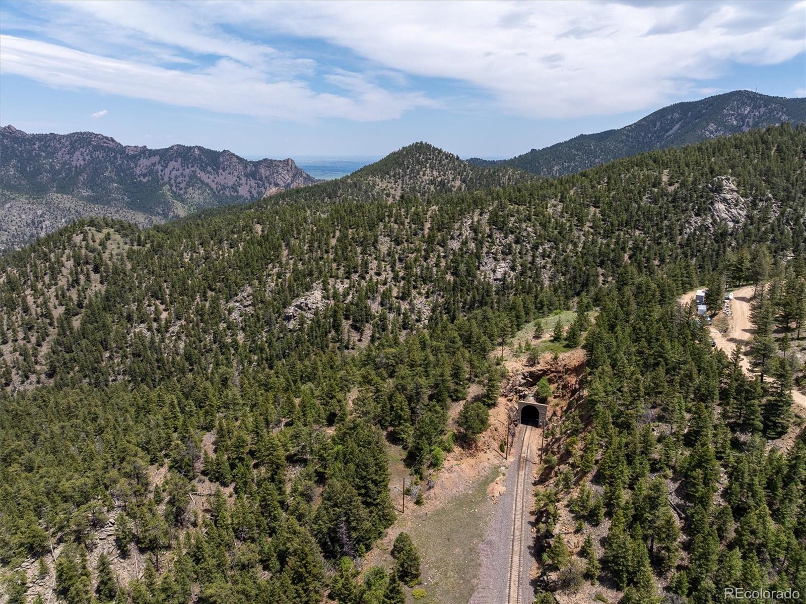 1546 Chute Road Golden, CO 80403 - Photo 24 of 36 a view of a town with mountains in the background