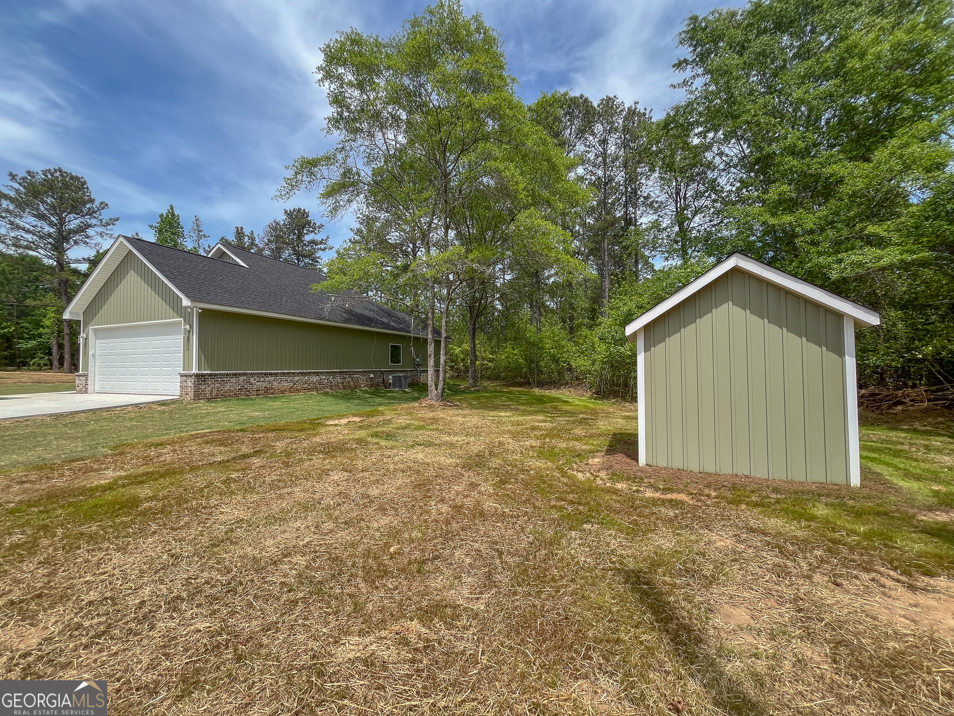711 Flanders Lane Dublin, GA 31021 - Photo 44 of 49 a house with trees in the background
