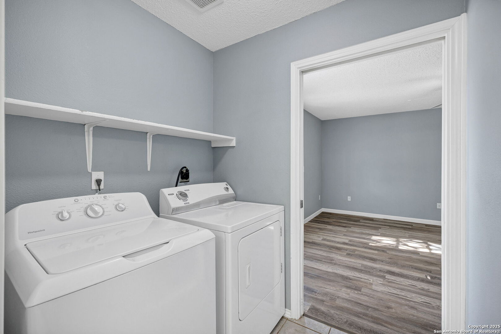 7362 Rustling Brook San Antonio, TX 78249 - Photo 15 of 36 a utility room with dryer and washer