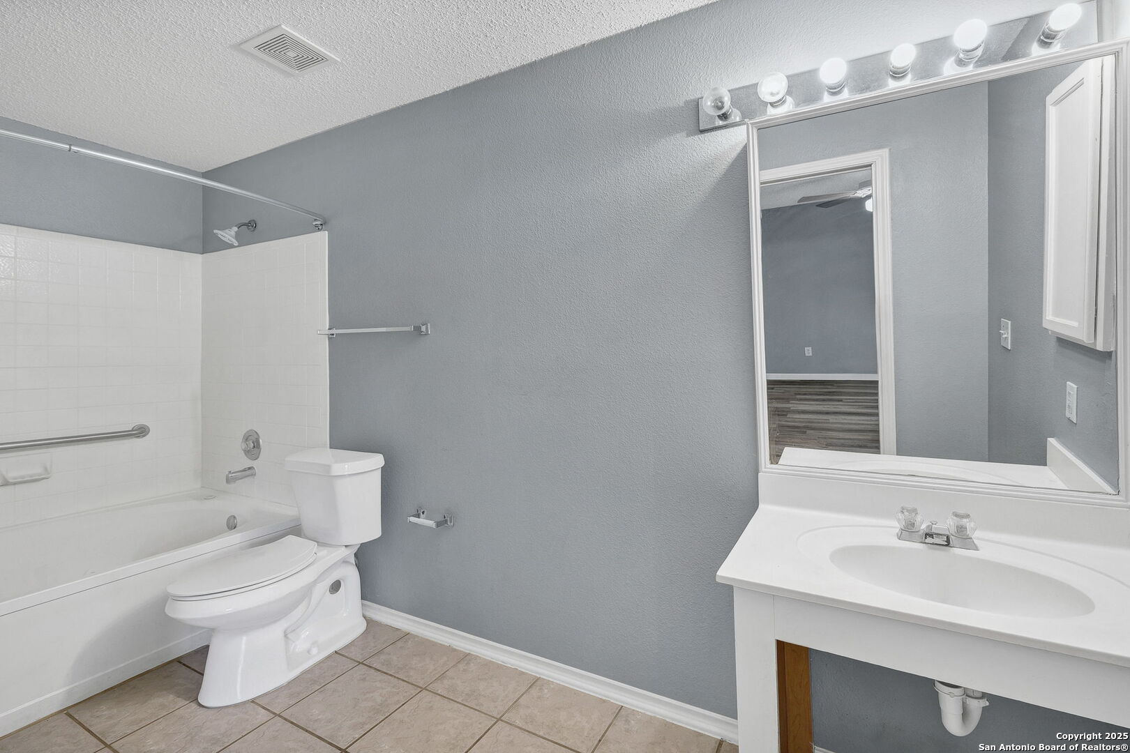 7362 Rustling Brook San Antonio, TX 78249 - Photo 20 of 36 a bathroom with a sink a toilet and shower