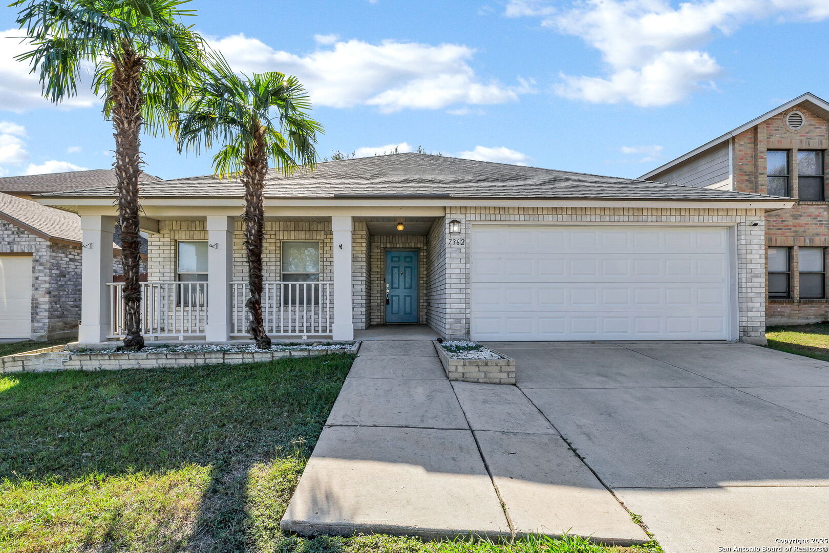 7362 Rustling Brook San Antonio, TX 78249 - Photo 2 of 36 a front view of a house with a garden and yard