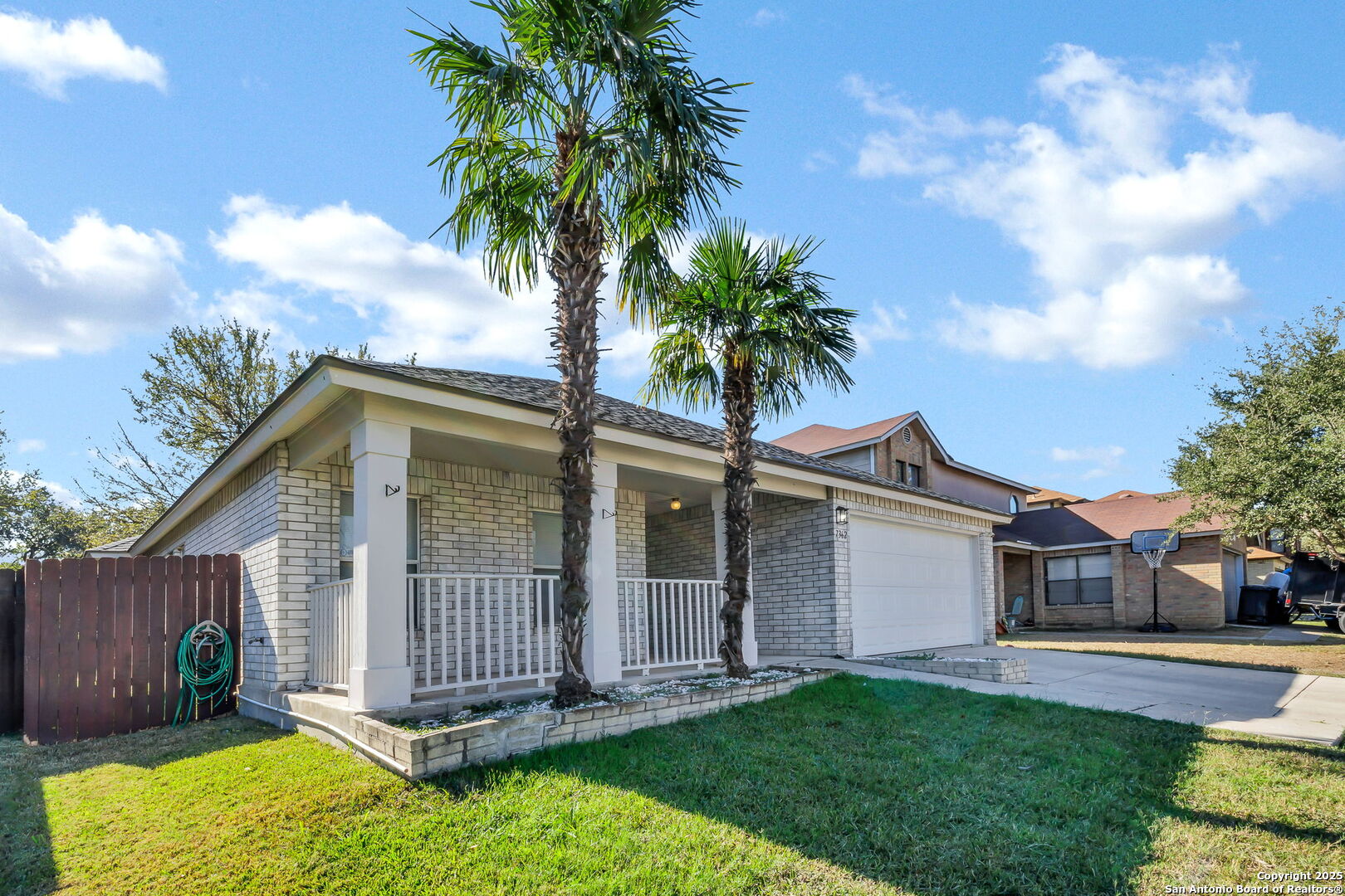 7362 Rustling Brook San Antonio, TX 78249 - Photo 3 of 36 a front view of a house with garden