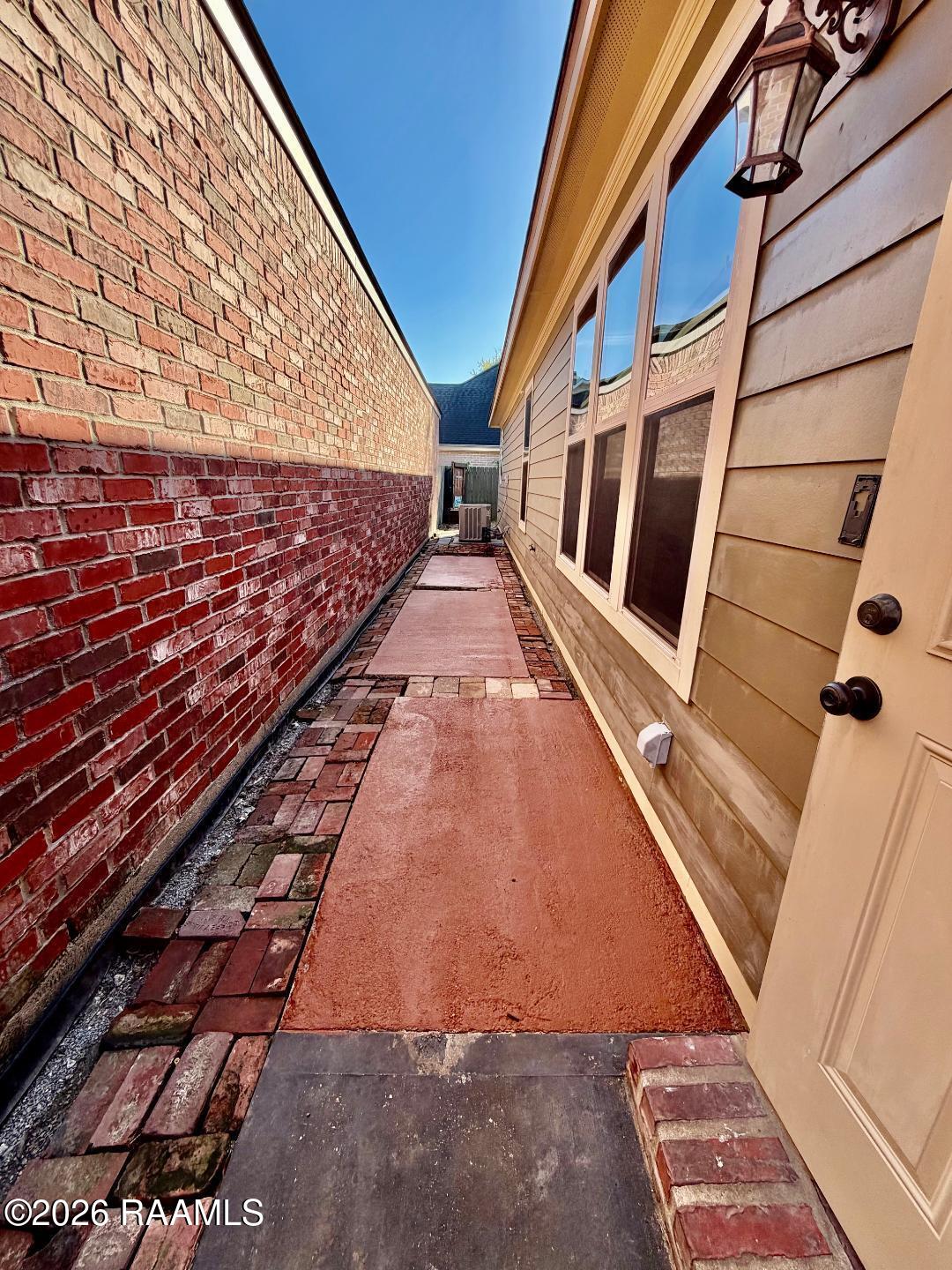 141 Treasure Cove Lafayette, LA 70508 - Photo 25 of 32 SIDE WALKWAY
