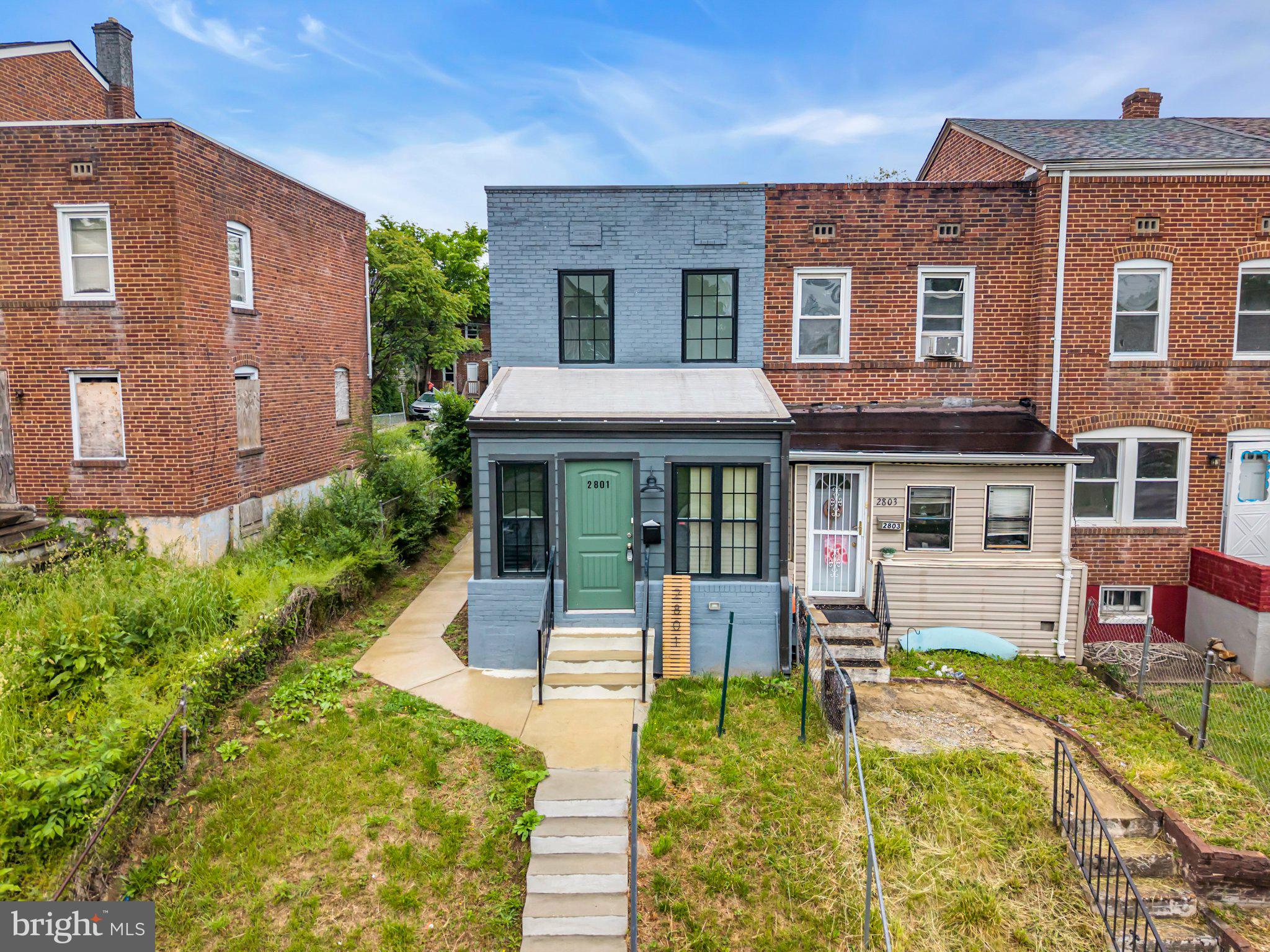2801 Round Road Baltimore, MD 21225 - Photo 1 of 29 a front view of a house with a yard table and chairs