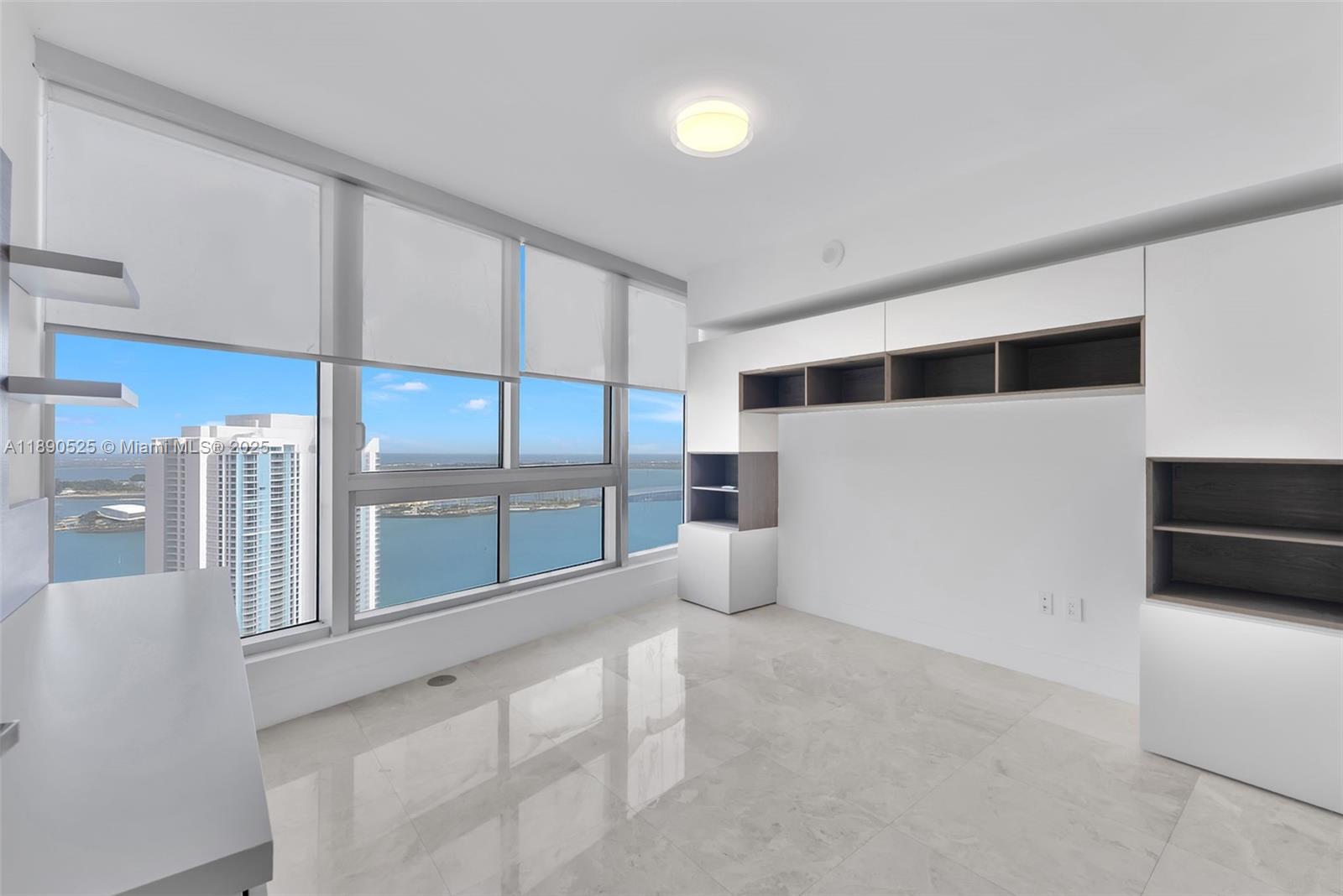 465 Brickell Avenue, Unit 4201 Miami, FL 33131 - Photo 12 of 16 a view of an empty room with glass door