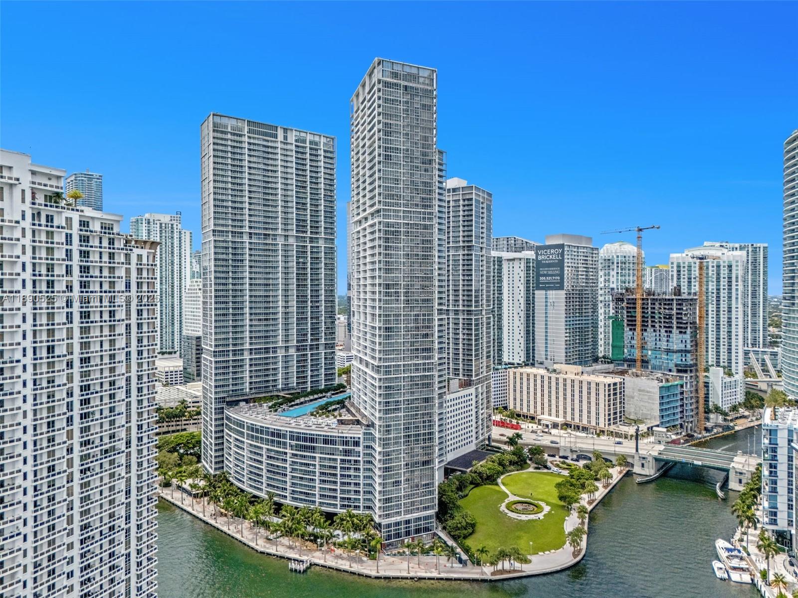 465 Brickell Avenue, Unit 4201 Miami, FL 33131 - Photo 14 of 16 a view of swimming pool with outdoor seating and city view