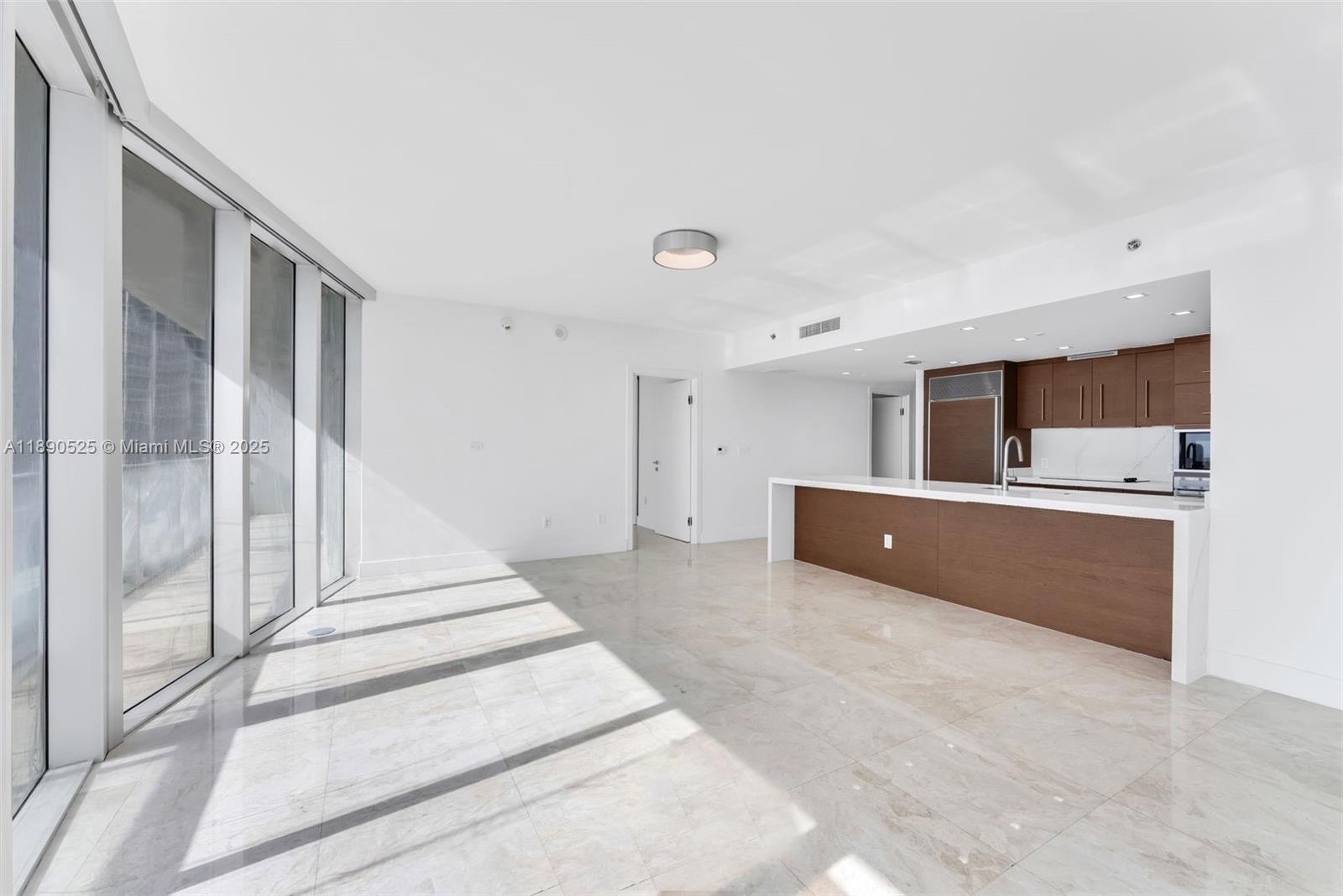 465 Brickell Avenue, Unit 4201 Miami, FL 33131 - Photo 2 of 16 a view of a kitchen with furniture and large windows