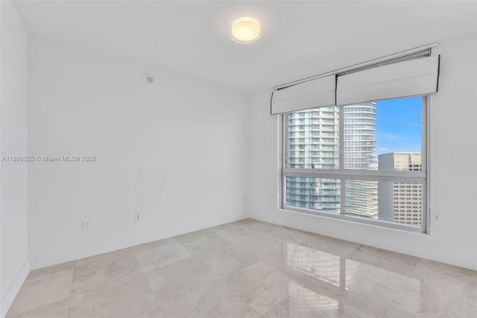465 Brickell Avenue, Unit 4201 Miami, FL 33131 - Photo 10 of 16 a view of an empty room with a window