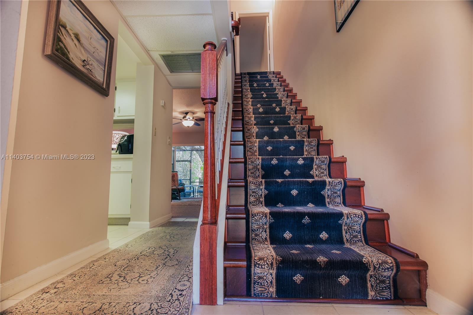 894 Southwest 9th St Circle, Unit 8 Boca Raton, FL 33486 - Photo 11 of 24 a view of a hallway with wooden floor