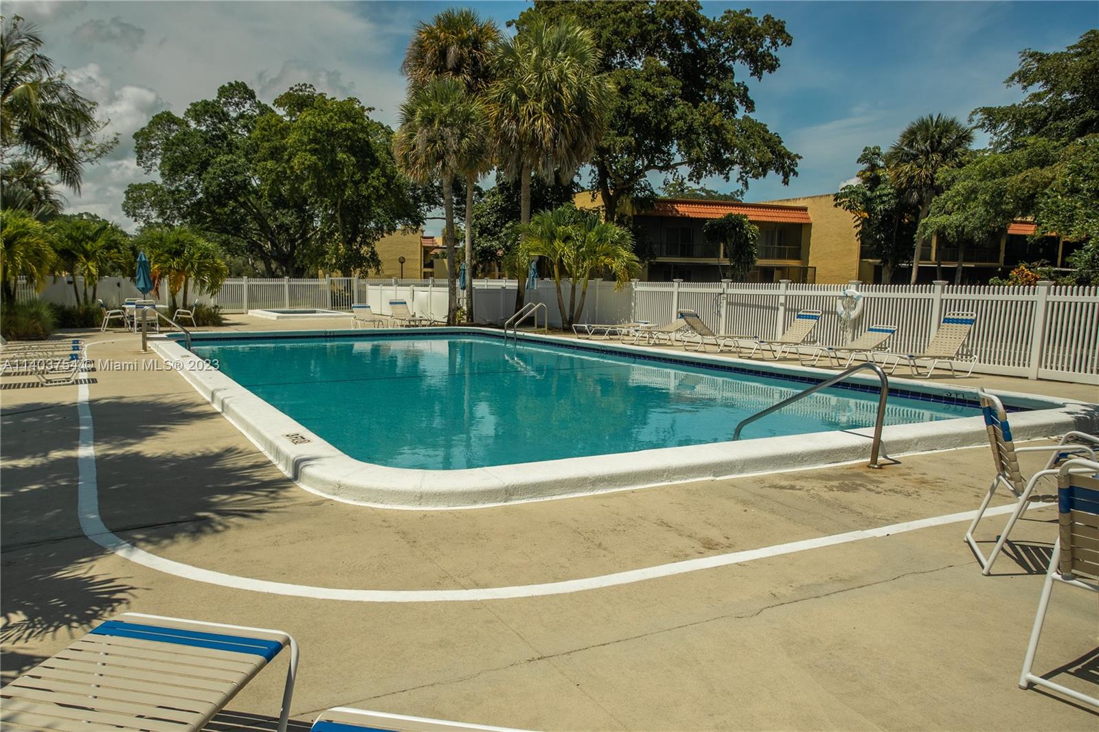 894 Southwest 9th St Circle, Unit 8 Boca Raton, FL 33486 - Photo 23 of 24 a view of a swimming pool with a patio