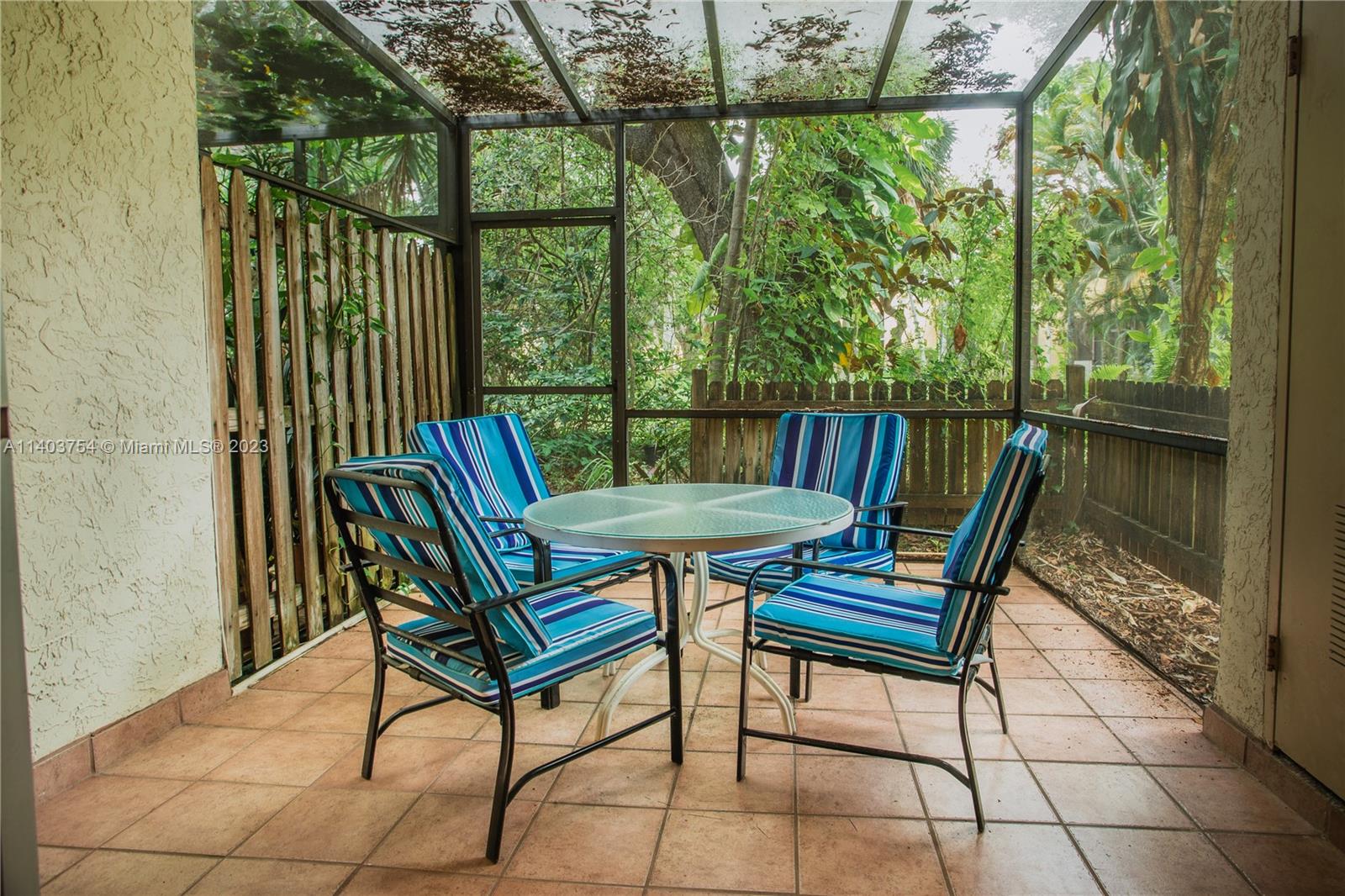894 Southwest 9th St Circle, Unit 8 Boca Raton, FL 33486 - Photo 6 of 24 a view of a chairs and table in the balcony