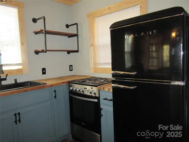 a kitchen with a sink and a stove