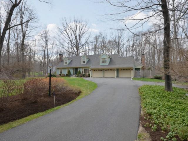 65 Woodlawn Drive Ridgefield, CT 06877 - Photo 1 of 1 a view of a street with a building in the background