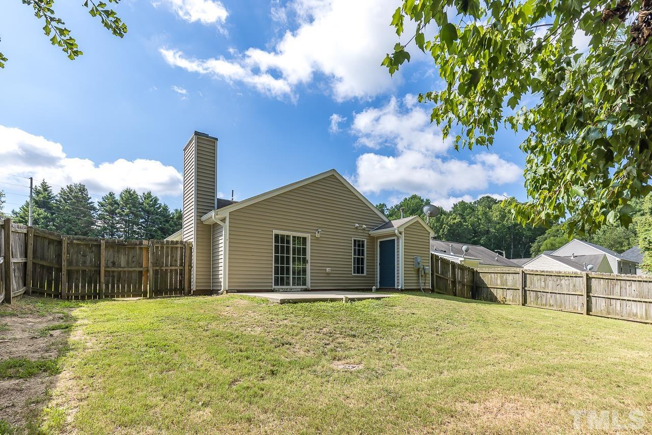 4032 Pearl Road Raleigh, NC 27610 - Photo 3 of 22 a front view of a house with a garden