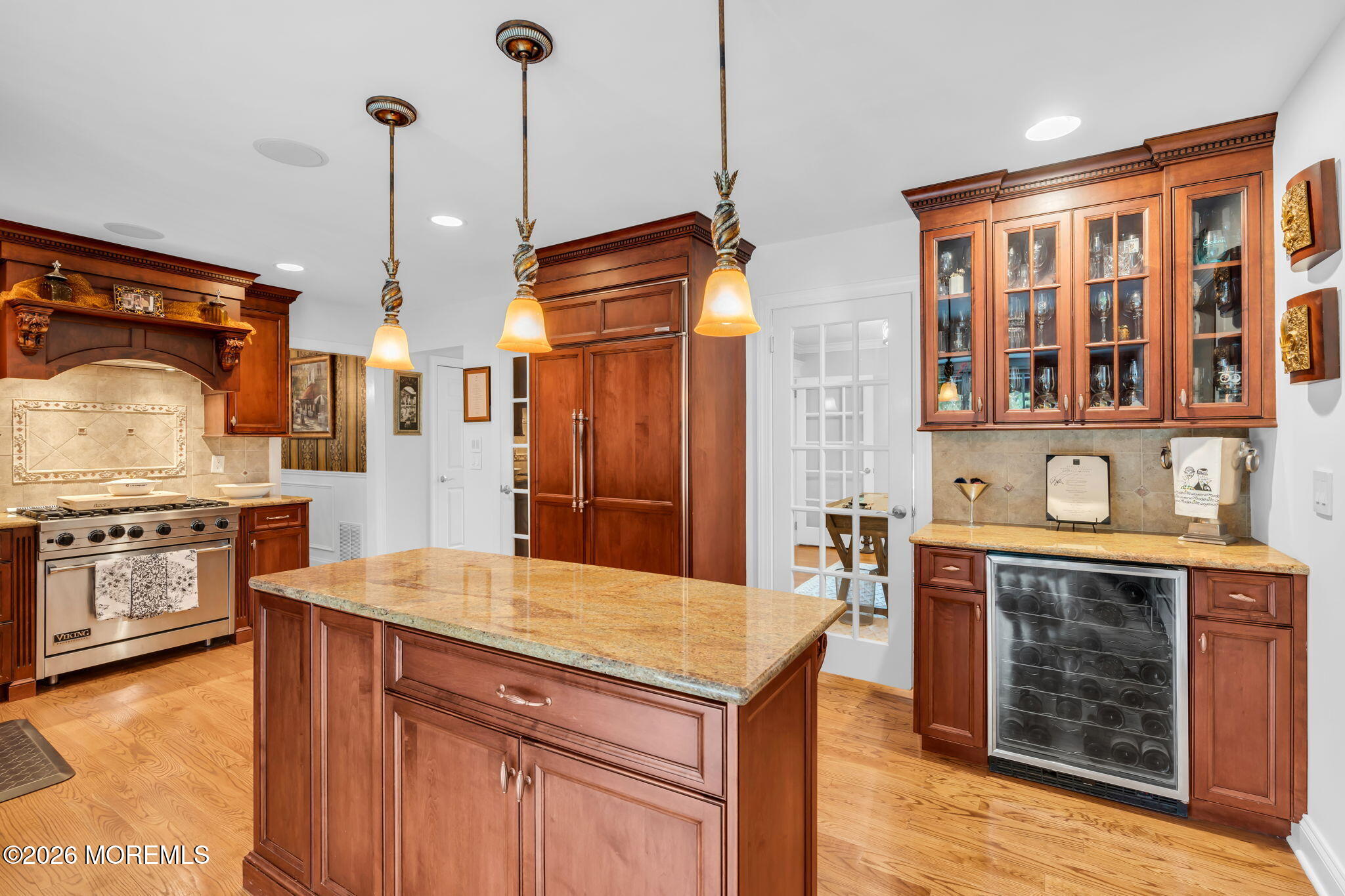 657 Valley Road Brielle, NJ 08730 - Photo 16 of 44 a kitchen with stainless steel appliances granite countertop a stove a sink and a refrigerator