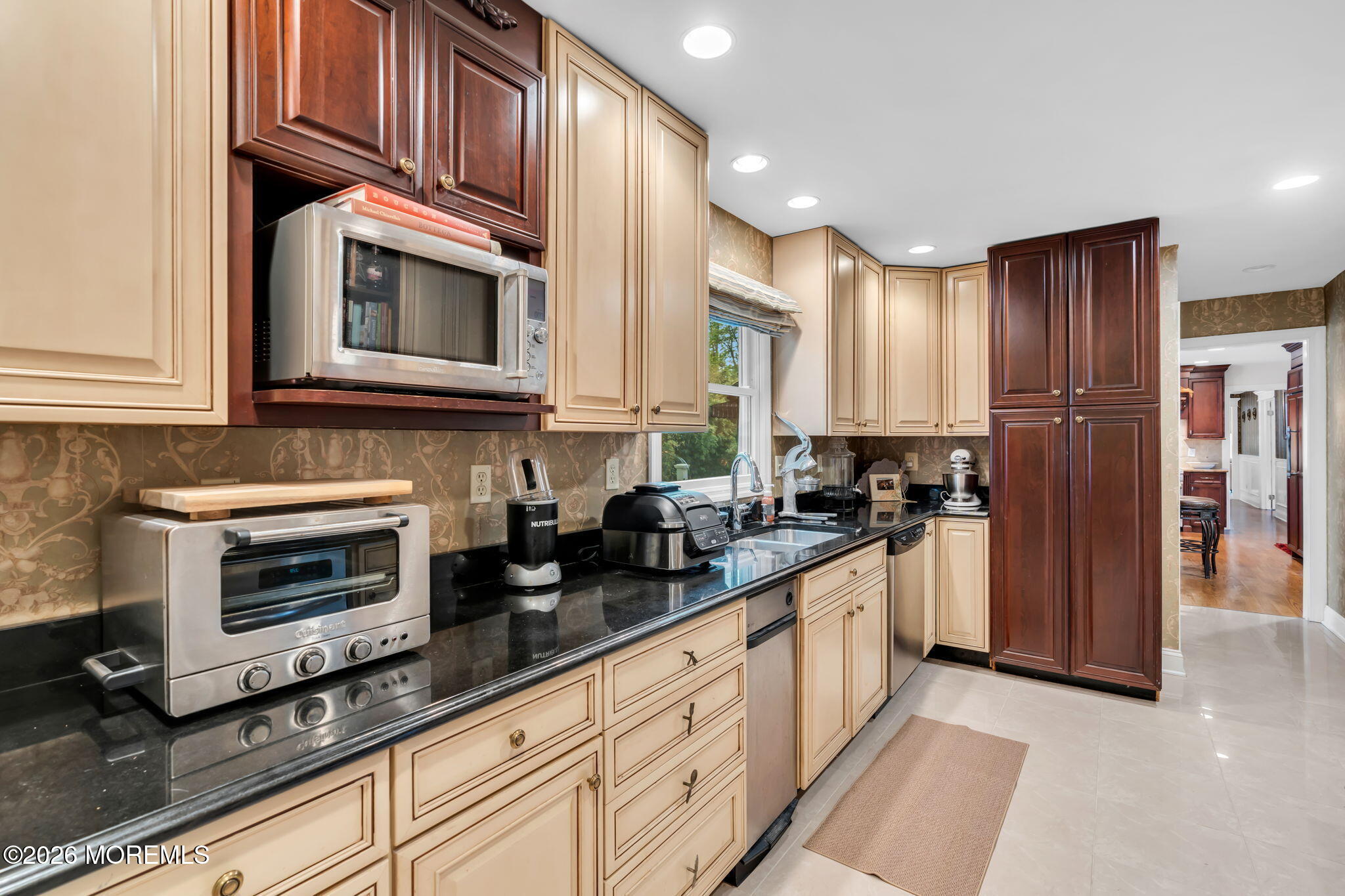 657 Valley Road Brielle, NJ 08730 - Photo 20 of 44 a kitchen with stainless steel appliances granite countertop a stove a sink and a microwave