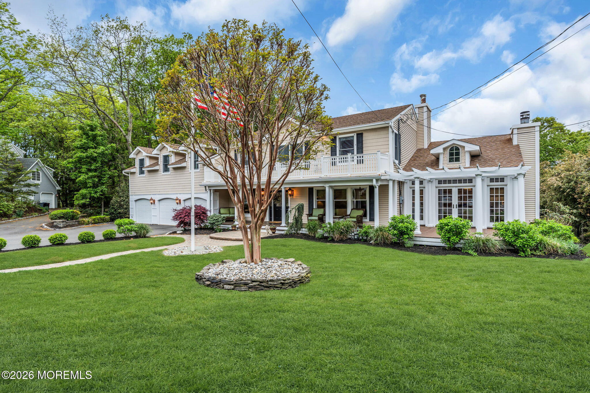 657 Valley Road Brielle, NJ 08730 - Photo 2 of 44 a front view of a house with a garden