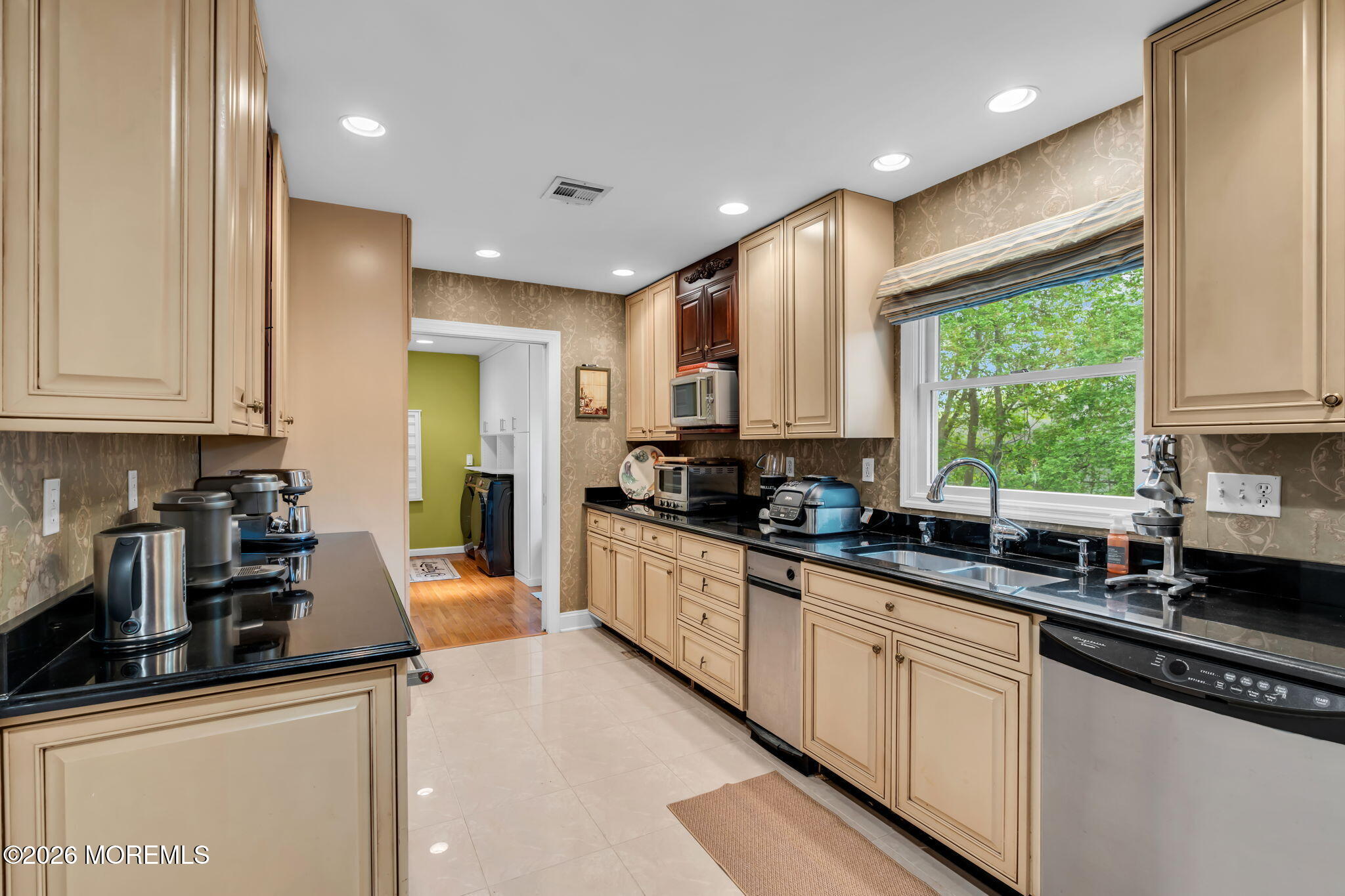 657 Valley Road Brielle, NJ 08730 - Photo 21 of 44 a kitchen with stainless steel appliances granite countertop a sink a stove and a refrigerator