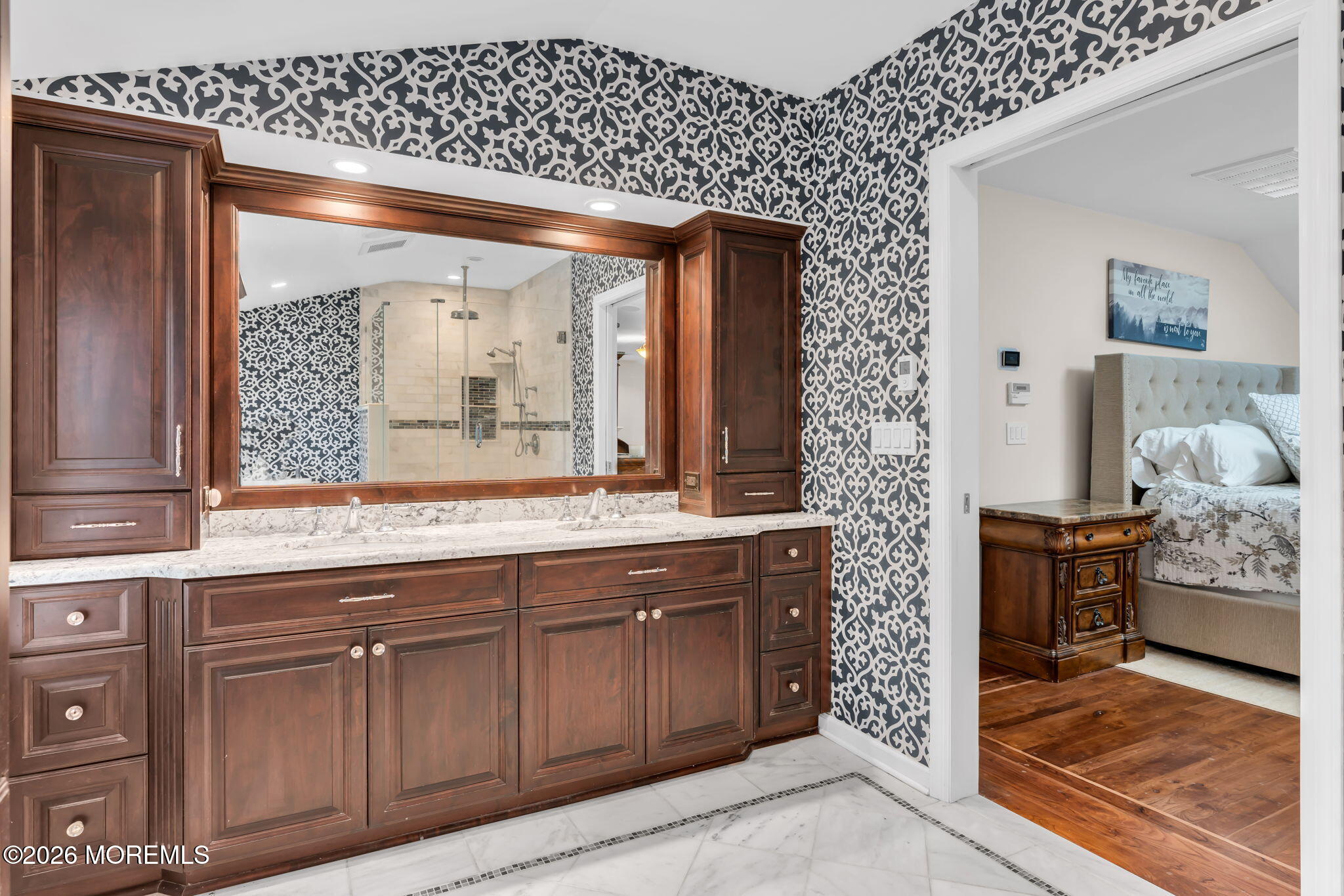 657 Valley Road Brielle, NJ 08730 - Photo 24 of 44 a bathroom with a granite countertop sink a large mirror and a shower