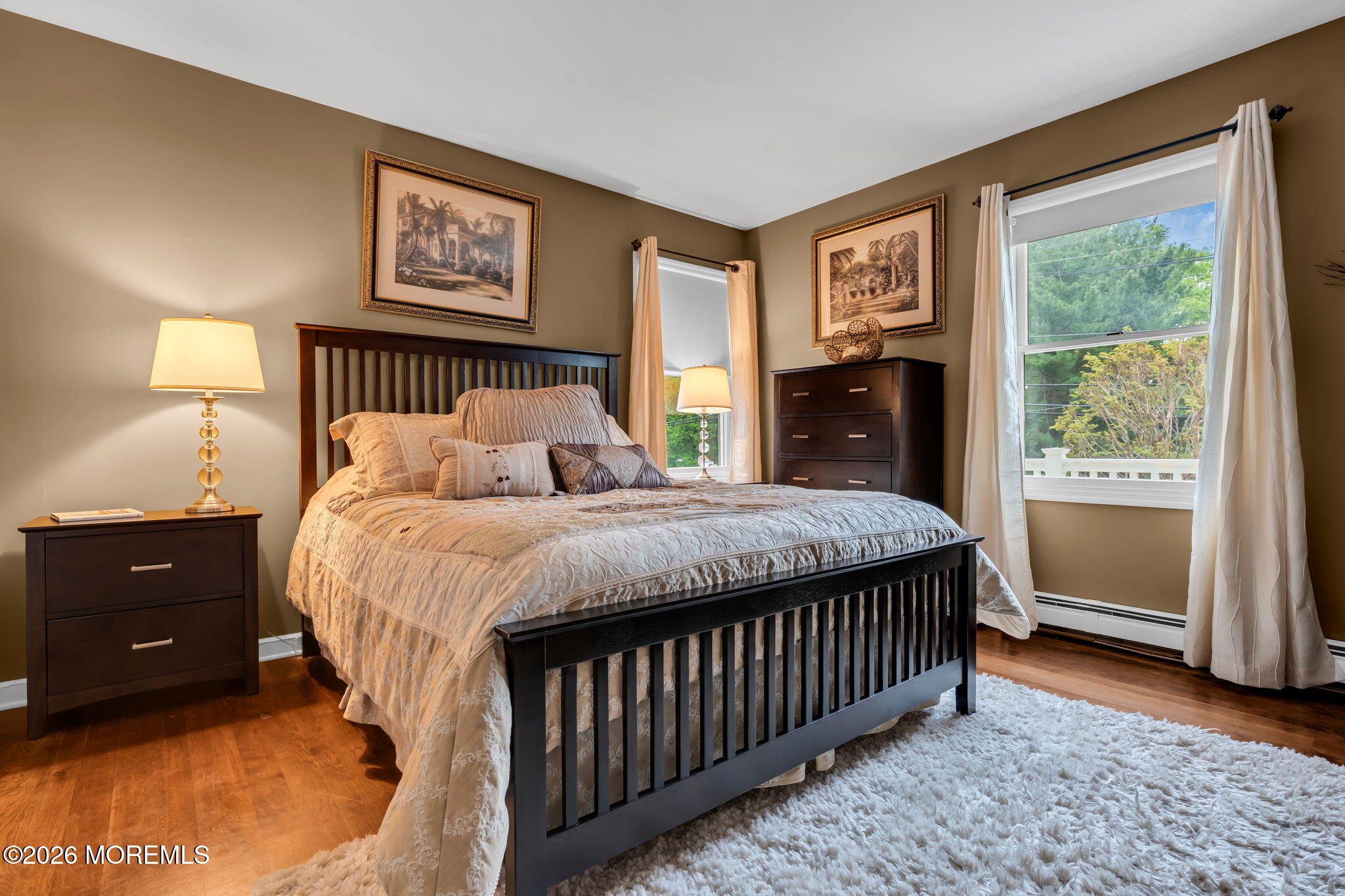 657 Valley Road Brielle, NJ 08730 - Photo 27 of 44 a bedroom with a bed and a lamp on dresser