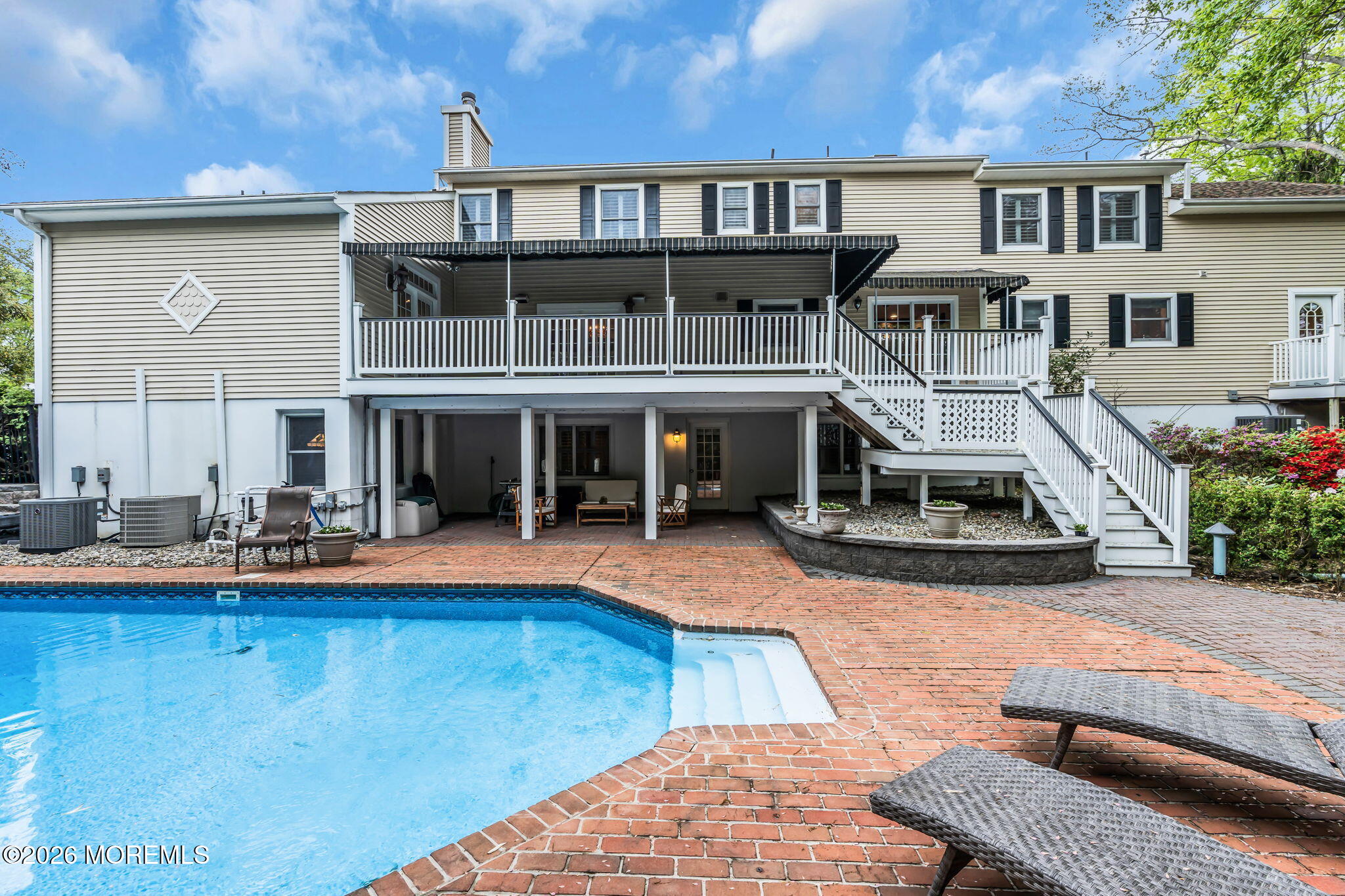 657 Valley Road Brielle, NJ 08730 - Photo 38 of 44 a view of a house with swimming pool and sitting area