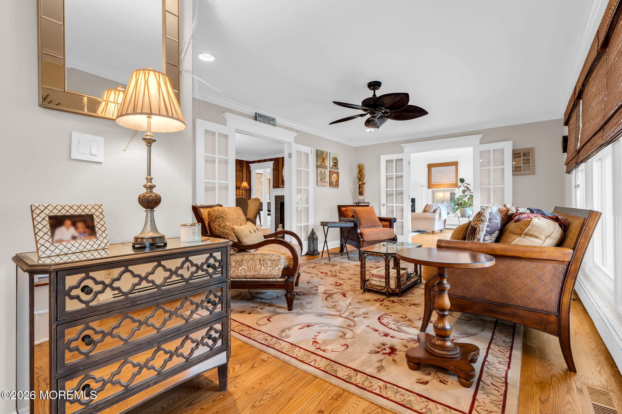 657 Valley Road Brielle, NJ 08730 - Photo 8 of 44 a living room with furniture a chandelier and a rug