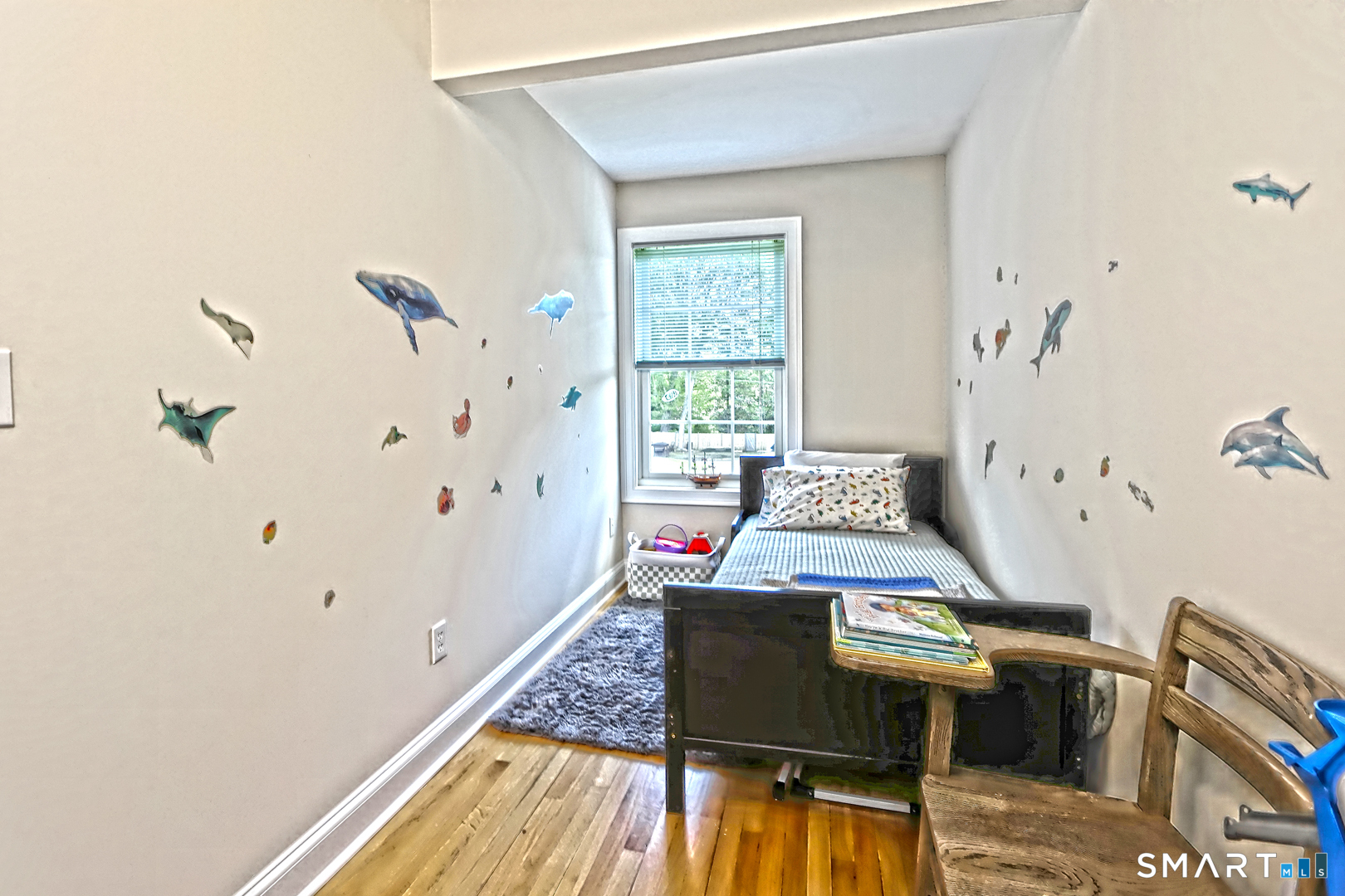 102 Lantern Court, Unit 102 Clinton, CT 06413 - Photo 33 of 36 a bedroom with a bed and a table in it